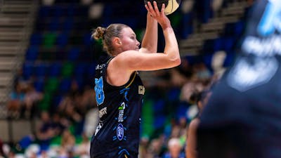 UC Capitals player shooting the basketball.