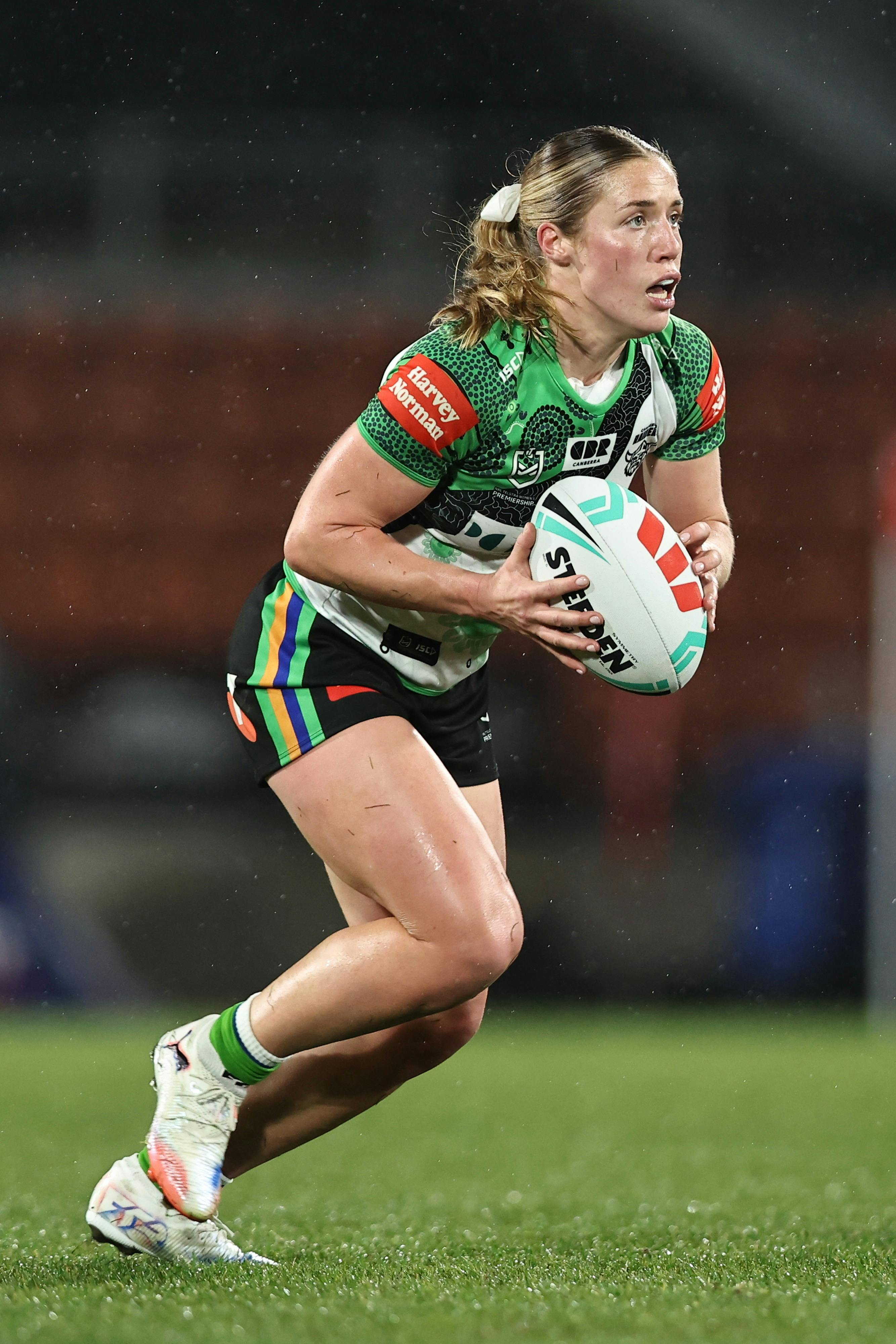 Canberra Raiders NRLW player Sophie Holyman running the ball.