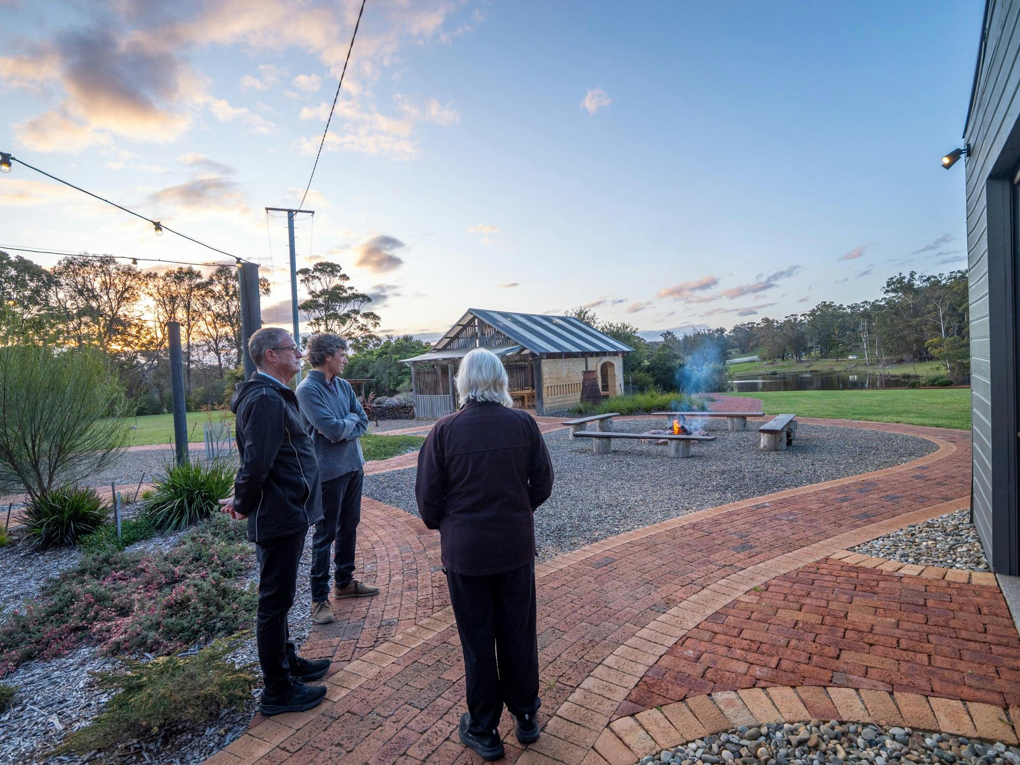 People watching the sunset and the campfire