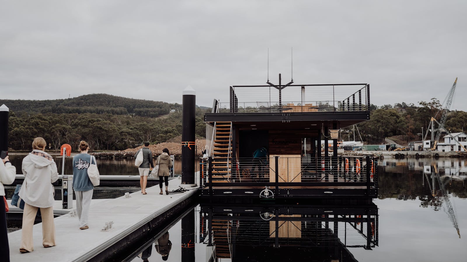 Kuuma sauna pontoon boat at berth in Southern Tasmania