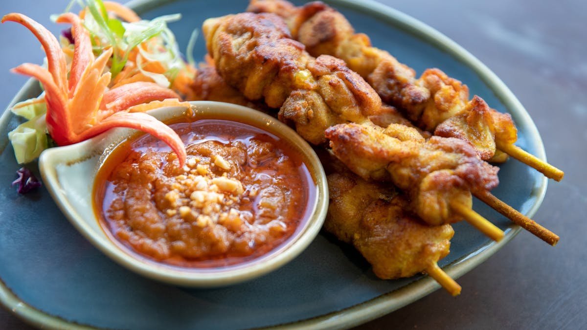 juicy Satay Chicken Skewers (made from chicken Maryland) with fragrant house-made peanut sauce