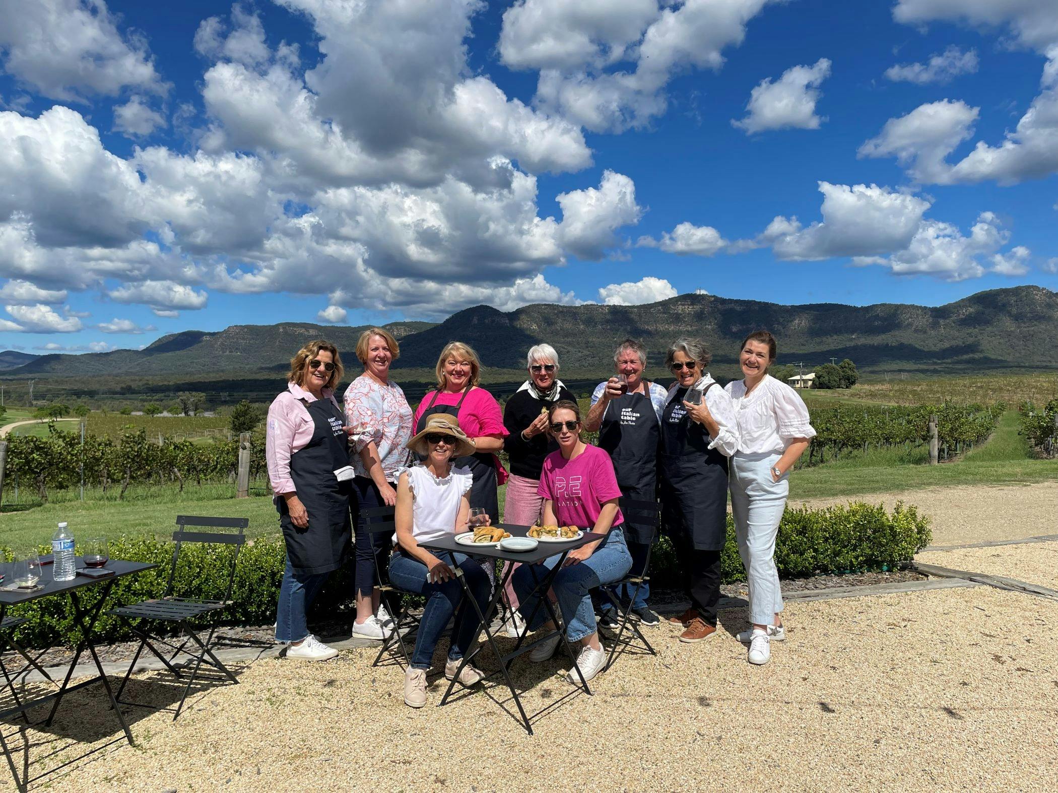 Group outdoors enjoying winery lunch