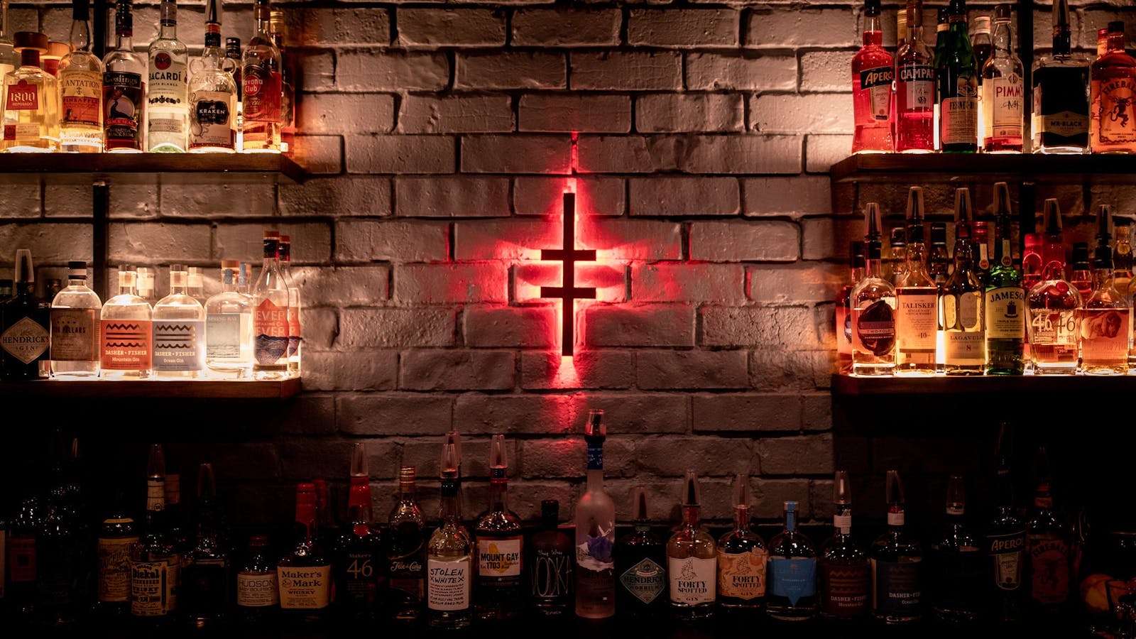 Altar's logo lights up the drinks selection in the bandroom bar