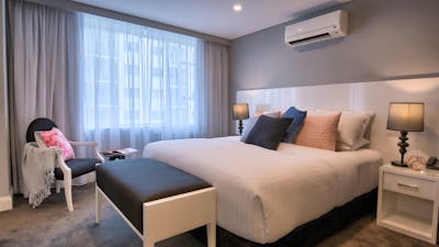 Luxurious Crown Suite bedroom featuring the Rex Cloud Bed