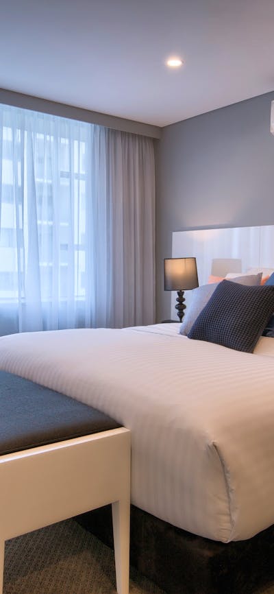 Luxurious Crown Suite bedroom featuring the Rex Cloud Bed