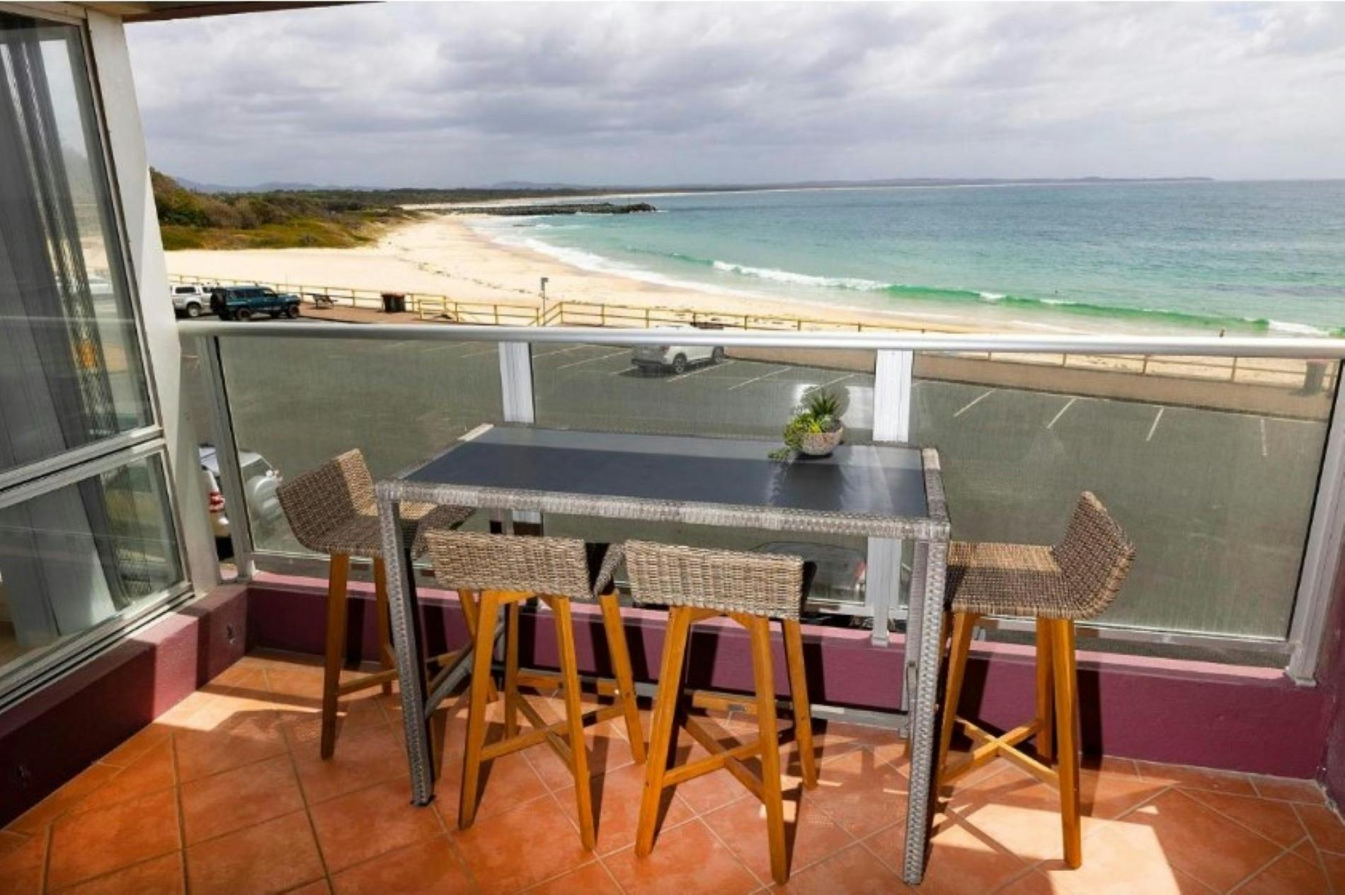 Balcony with incredible beach views and high table setting