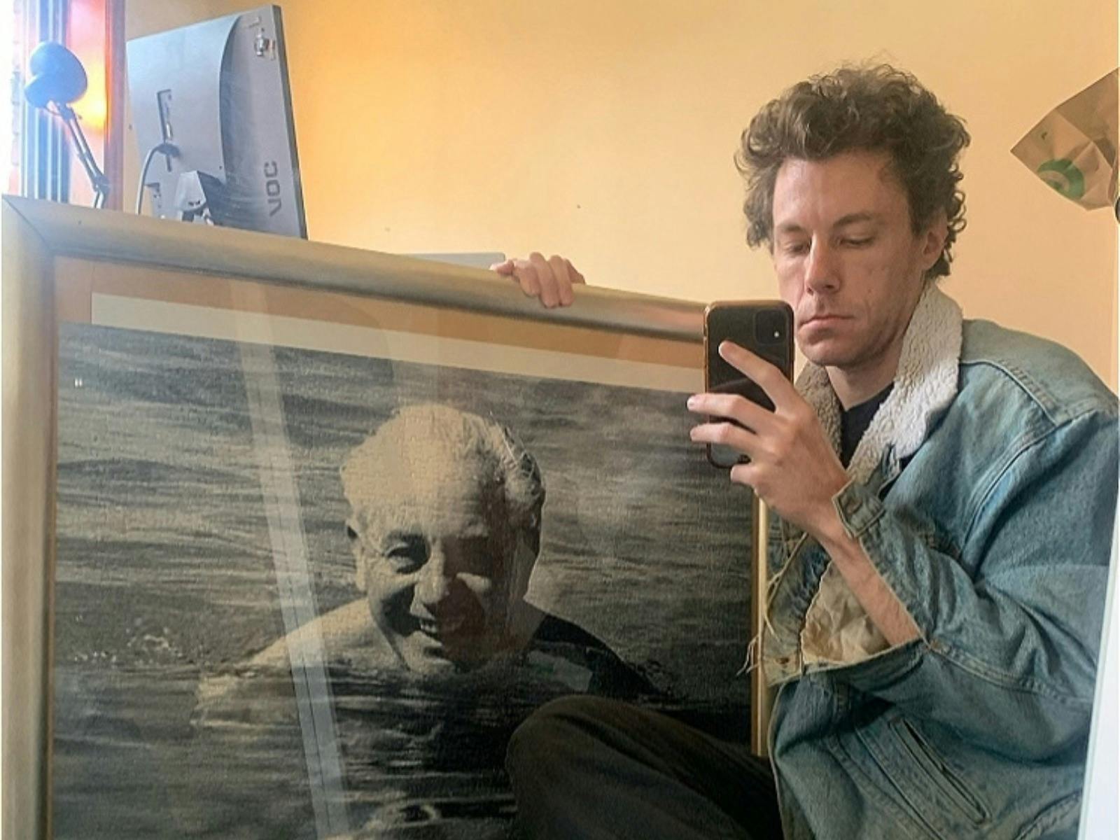 james.haha.nice holding a photo of Harold Holt swimming