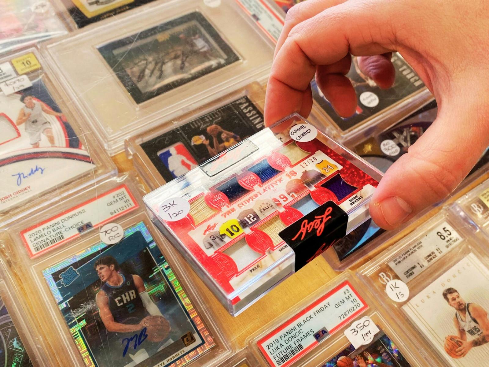 One of one sports card with parts of player jerseys