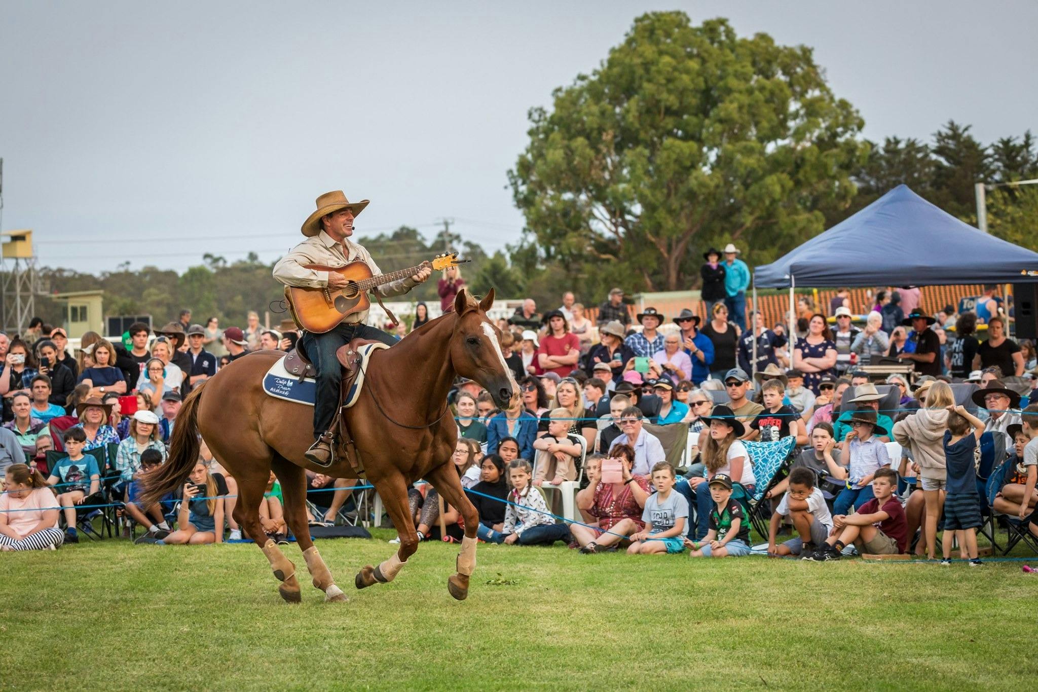 Tom Curtain riding a horse wh