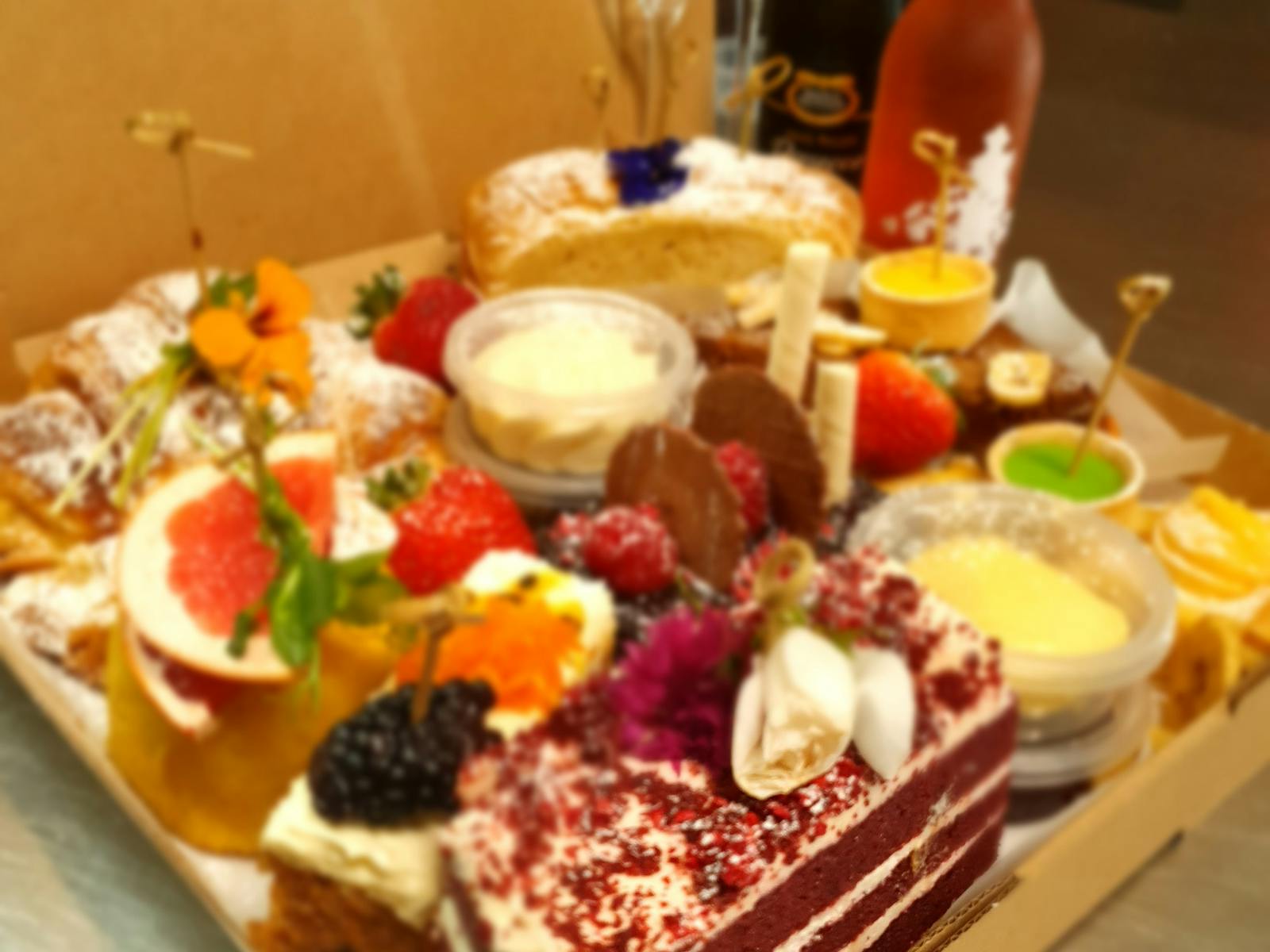 Rich velvety cake with a light citrus tart and famous scones paired with a Moscato or prosecco