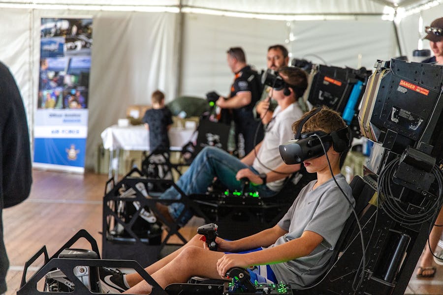 Kids enjoying the latest flight simulators at Wings Over Shellharbour
