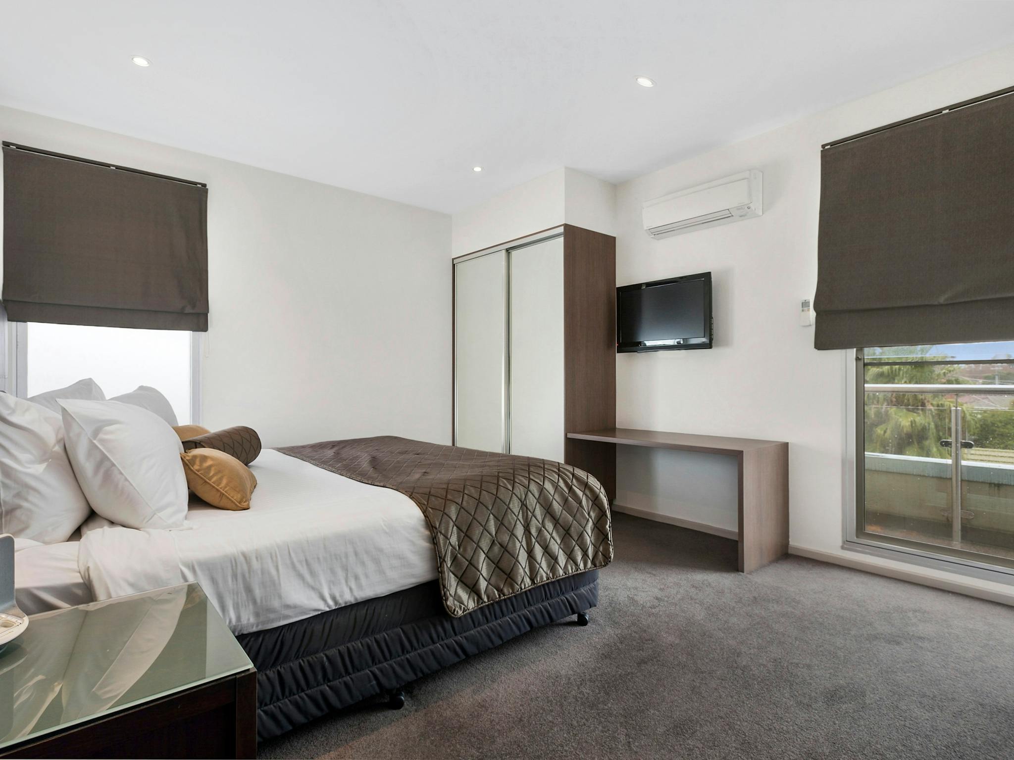 The Gateway's Two Bedroom Apartment offers a master bedroom with queen bed, robe & television