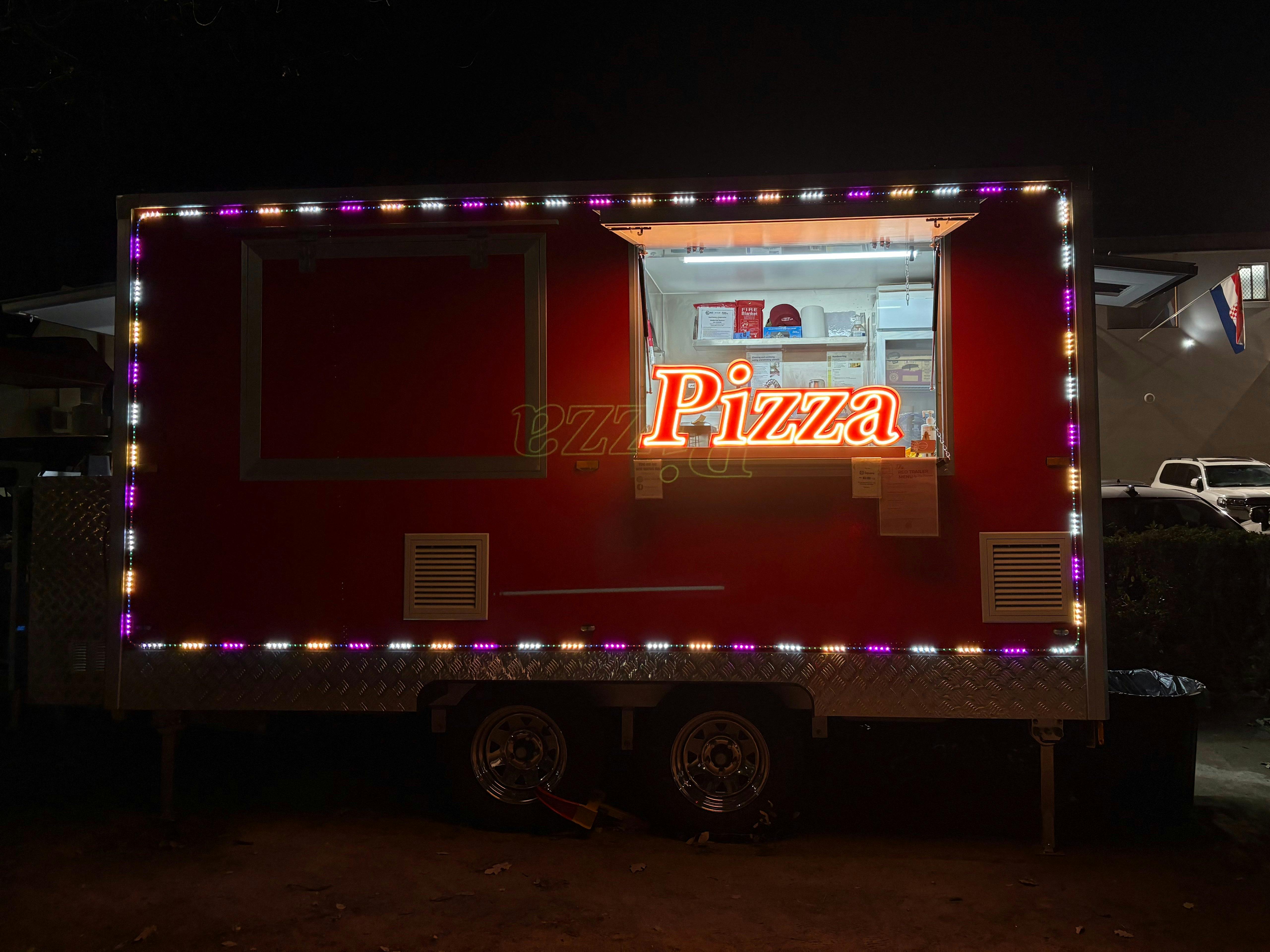 Pizza trailer at night outside of Australian Croatian club in Turner