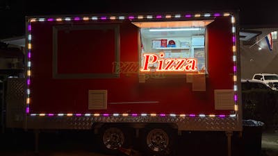 Pizza trailer at night outside of Australian Croatian club in Turner