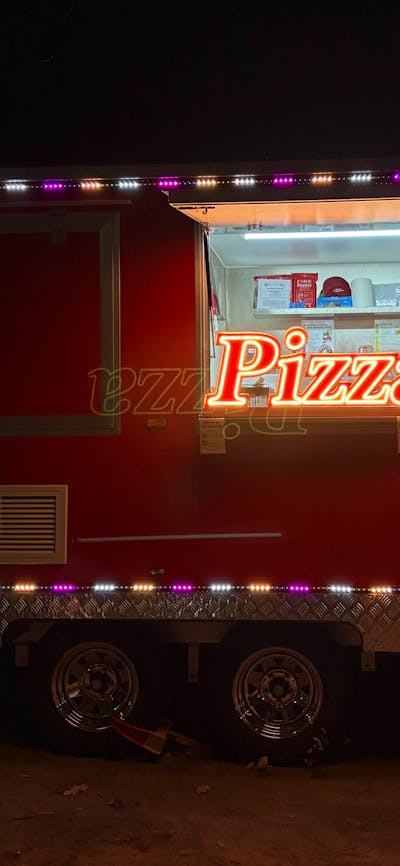 Pizza trailer at night outside of Australian Croatian club in Turner
