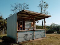 Outdoor bar area overlooking the Tinaroo dam and surrounding mountains on the Atherton Tablelands