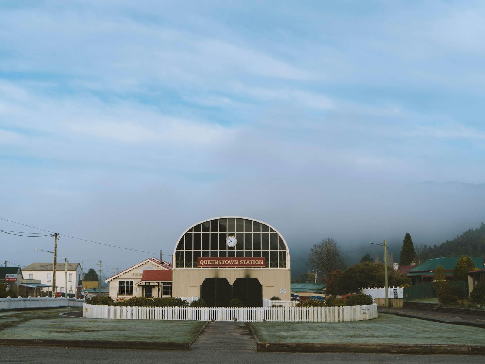 a misty morning at queenstown station, a domed building with two large doors