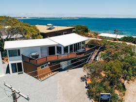 An aerial view of the house with the spectacular sea view behind