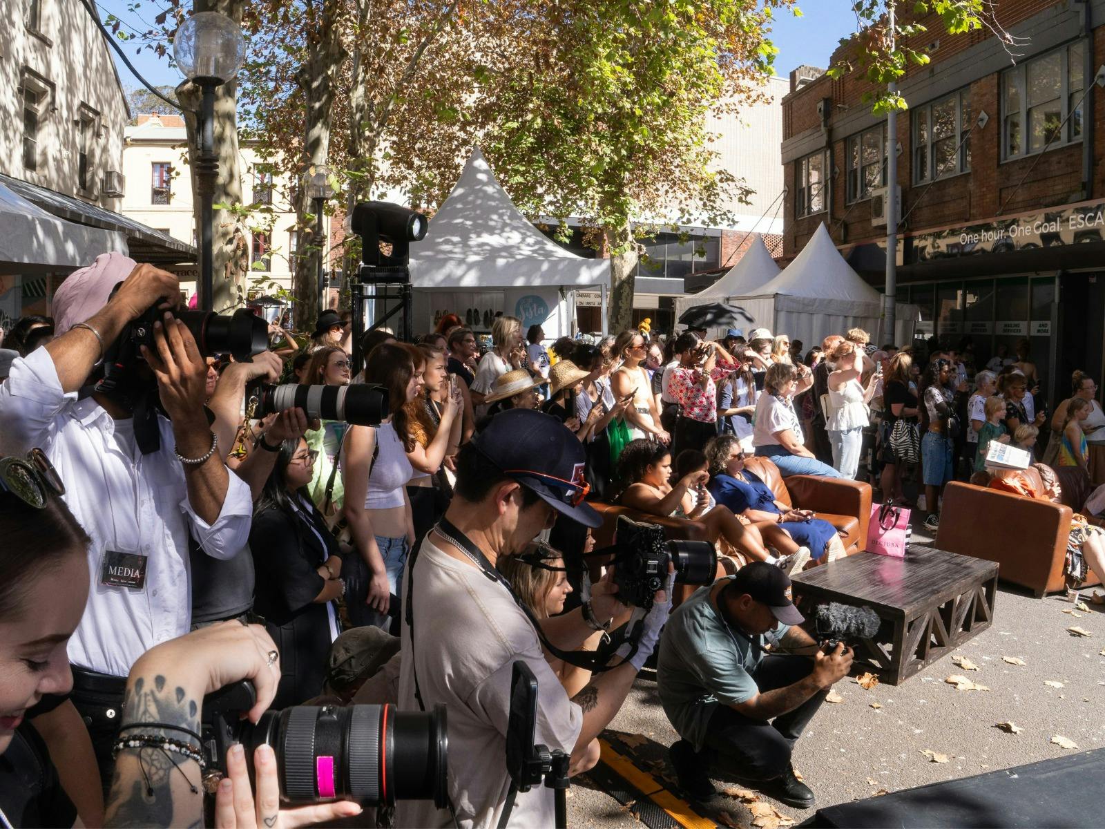 Media pit and crowd at Conscious Couture Festival 2025 runway.