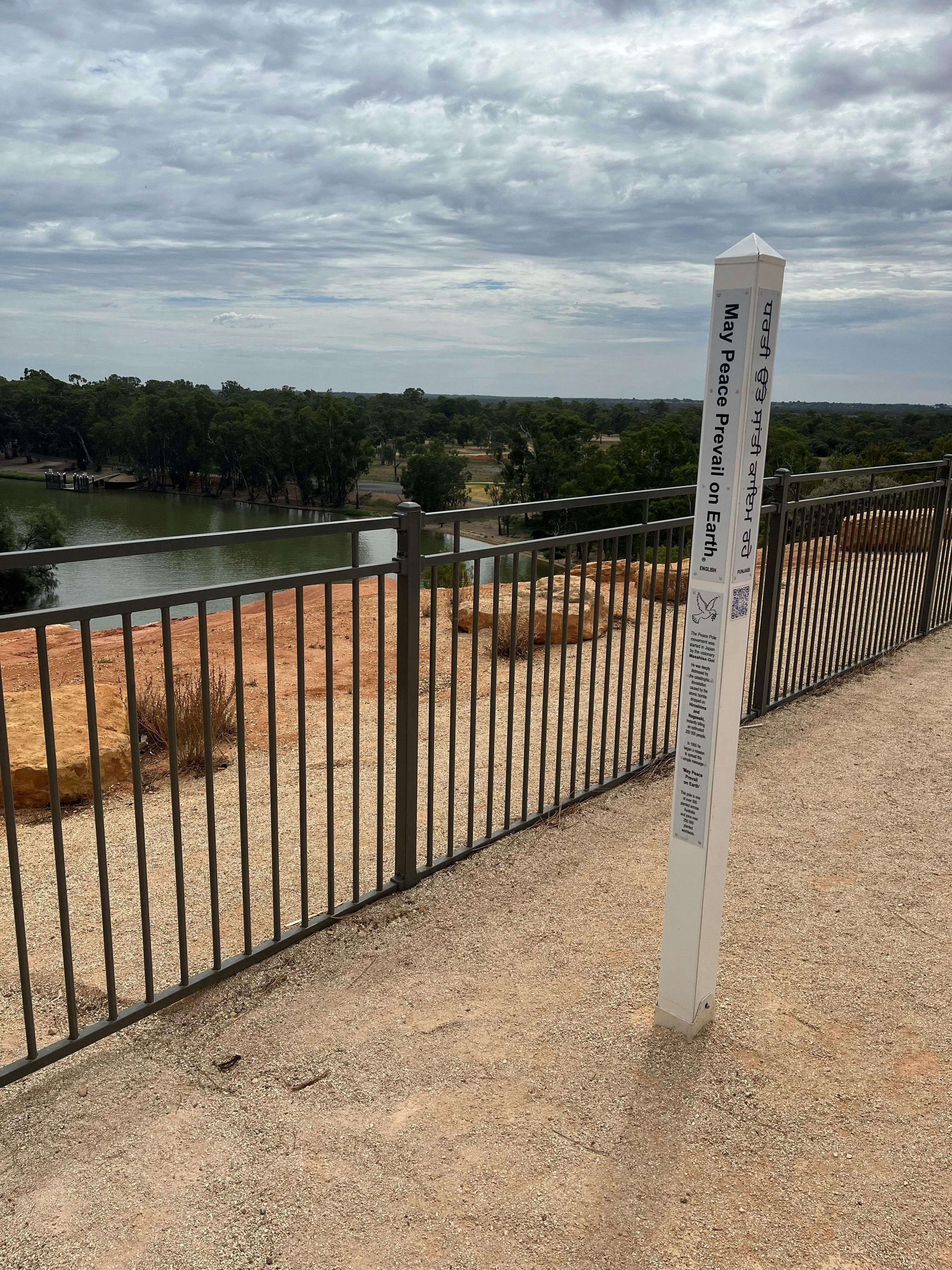 A 'Peace Pole' - one of over 500 in Australia - is installed at the lookout