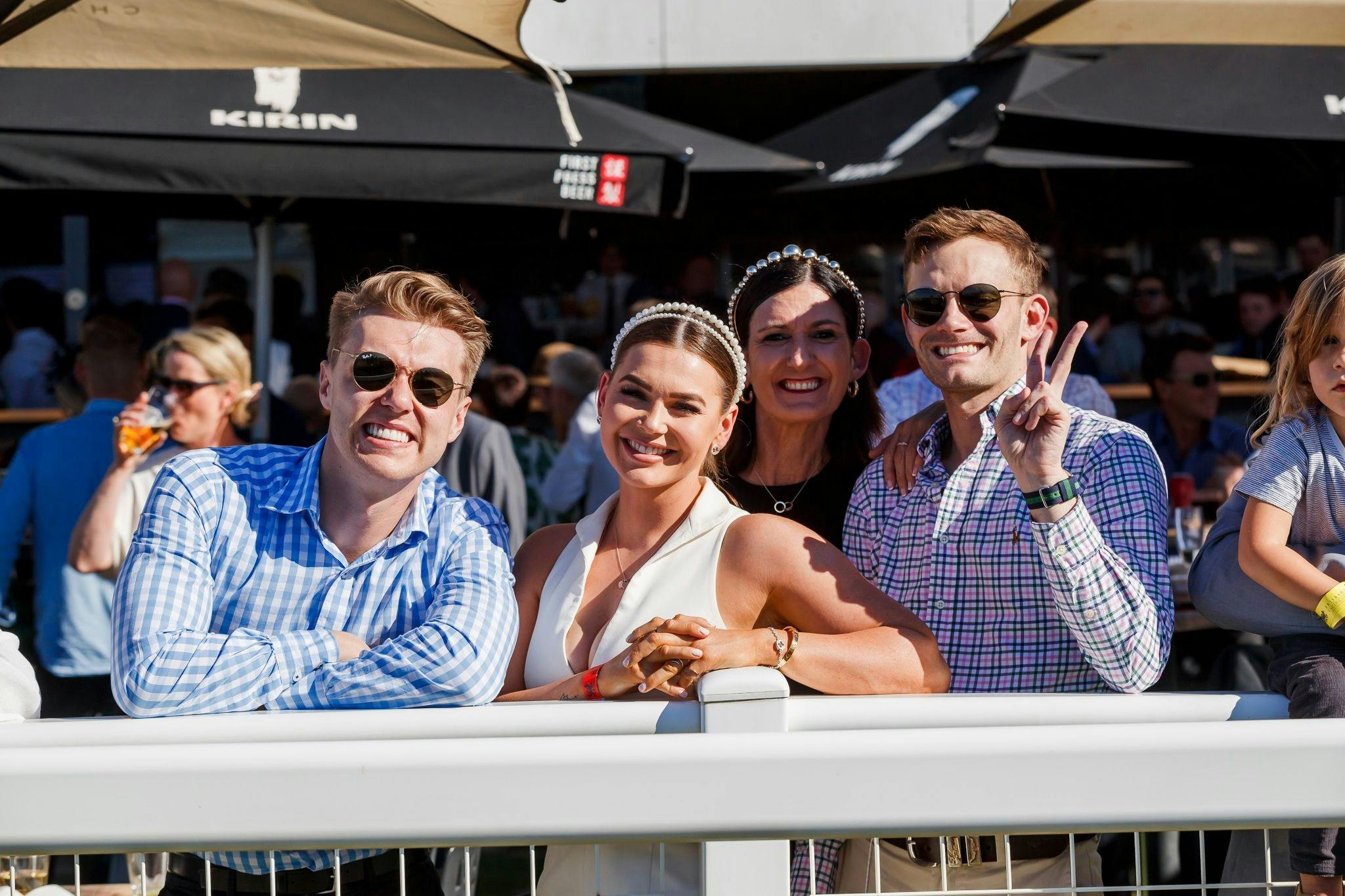 Racing fans enjoy a day trackside at Doomben Racecourse