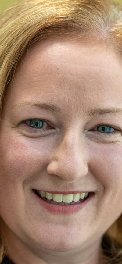 A woman with blonde hair smiling