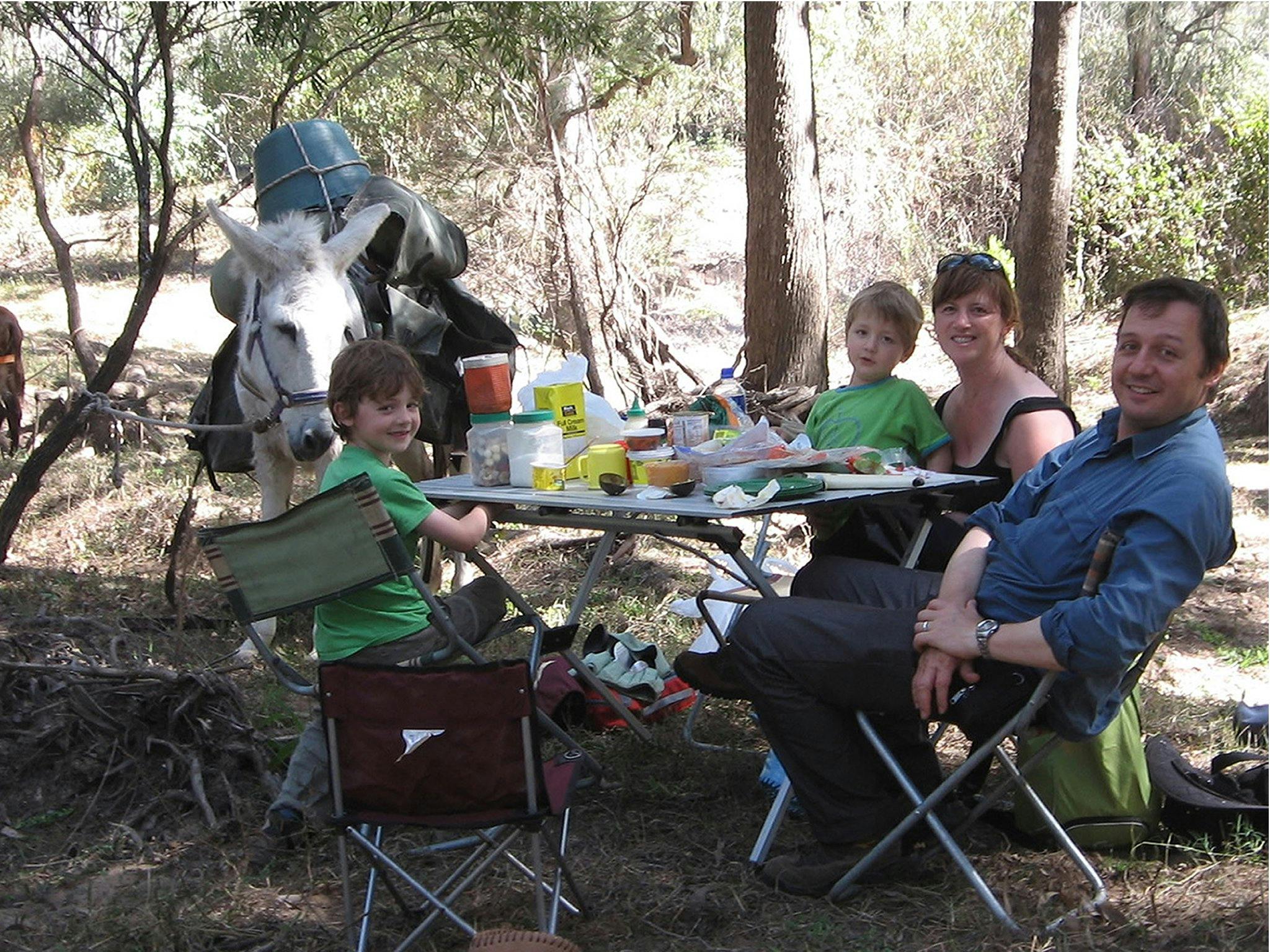 Family Lunch on the Banks of the Wild River during a Wild River Ramble Walk. Charlie Donkey watching