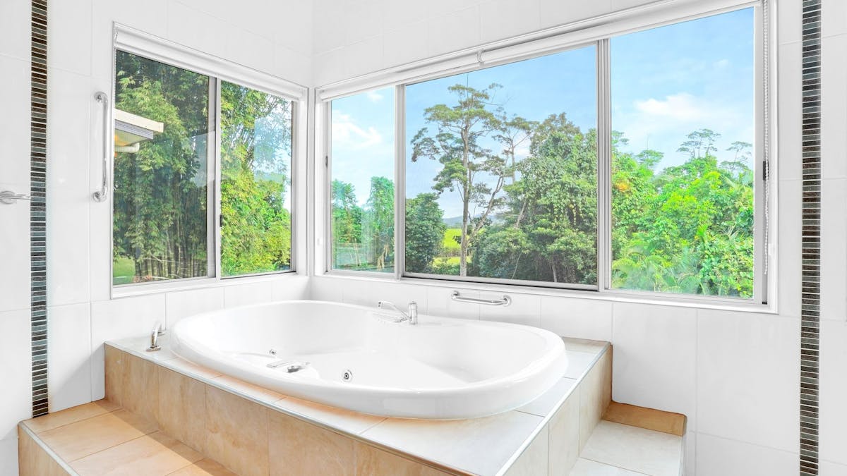Two person spa with mountain and rainforest views