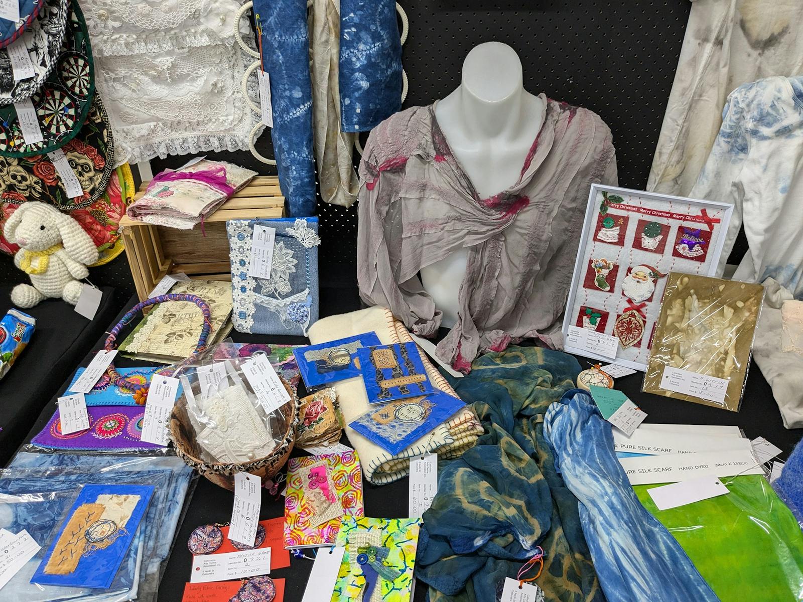 Printed textiles, notebooks, plus jewellery and items made of lace at CACA's Artisan Fair