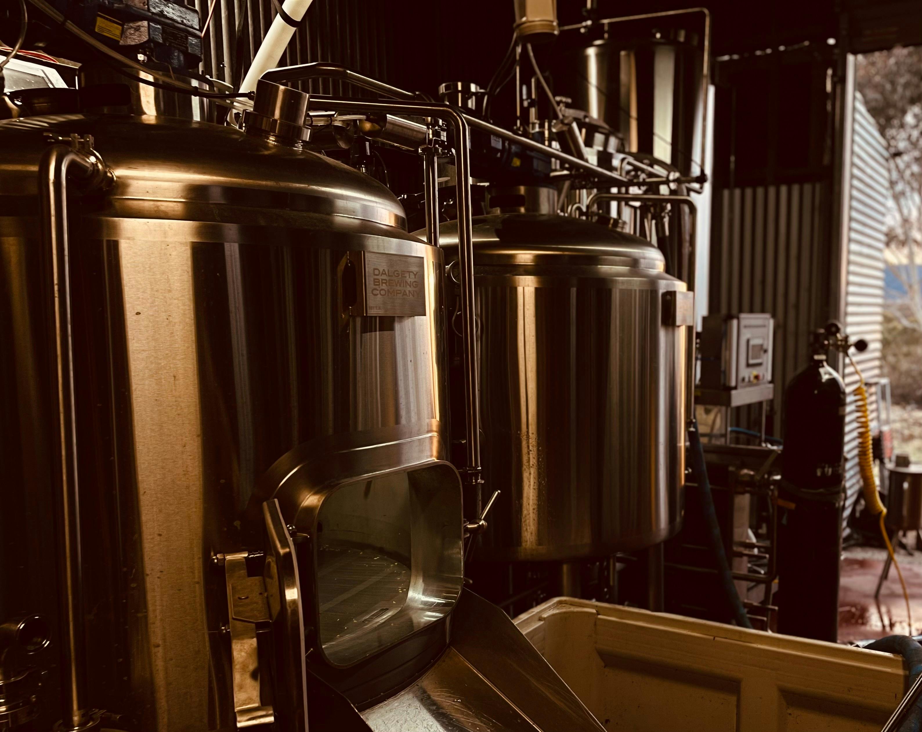 A photo of the brewery itself, two large silver tanks