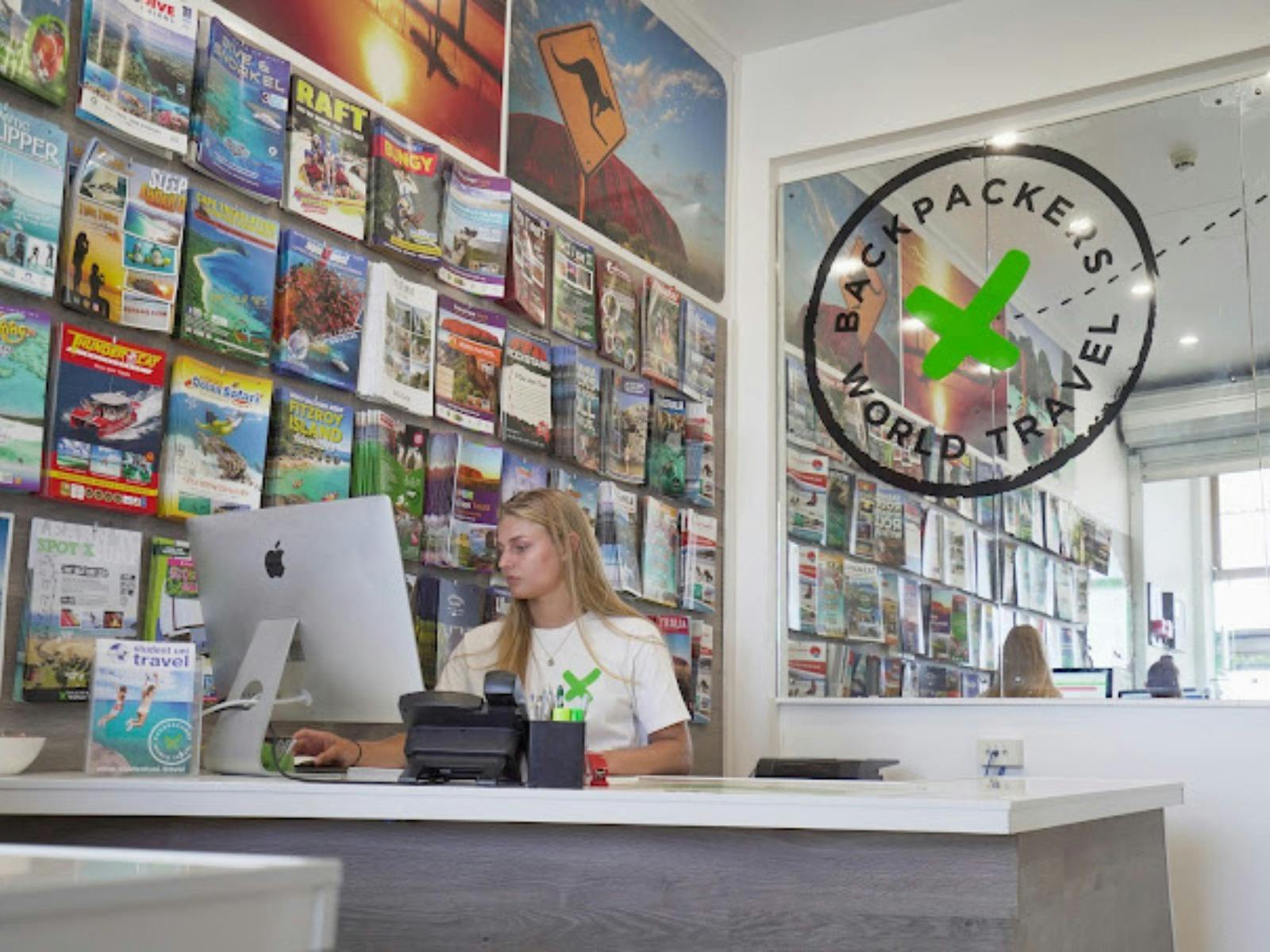 A staff member working at a computer desk