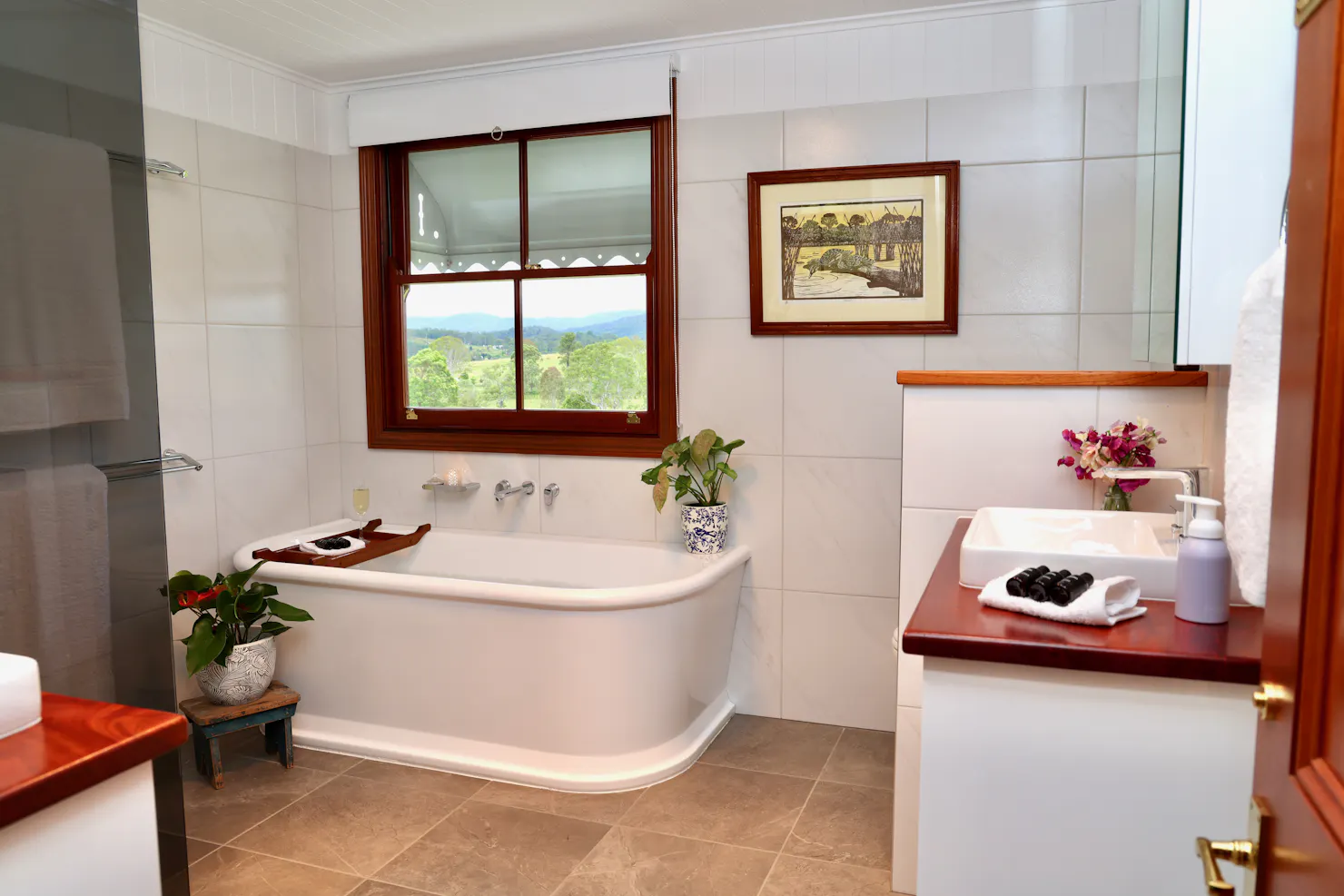 Full bathroom including large bathtub