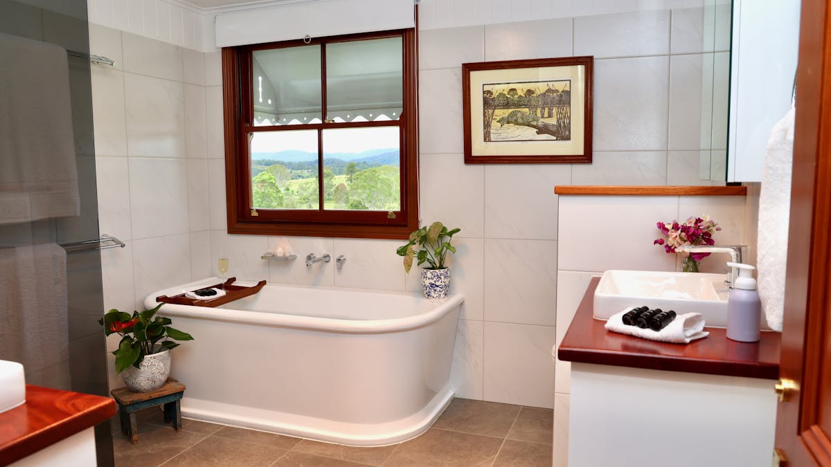 Full bathroom including large bathtub