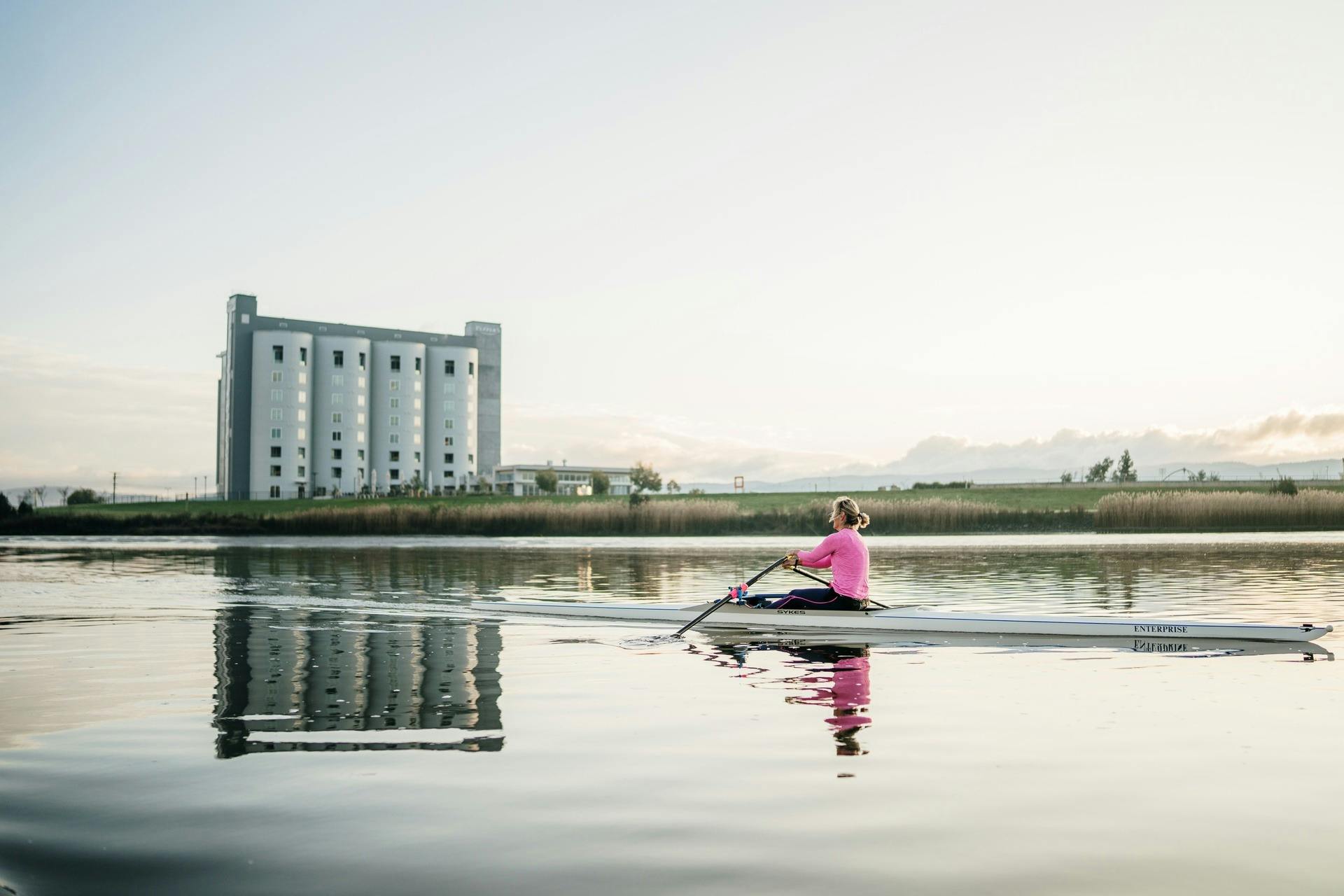 A person rowing on a river
