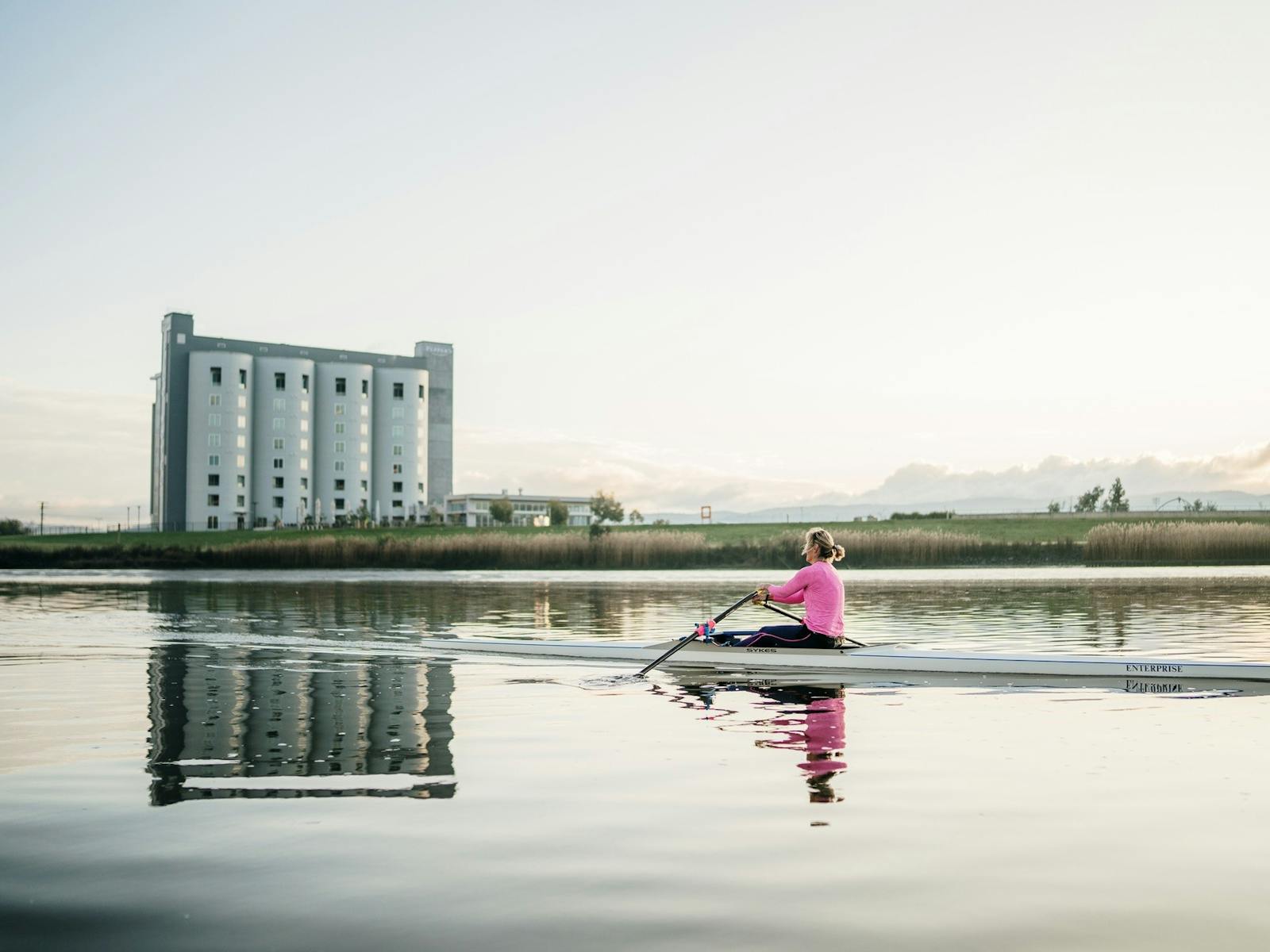 A person rowing on a river