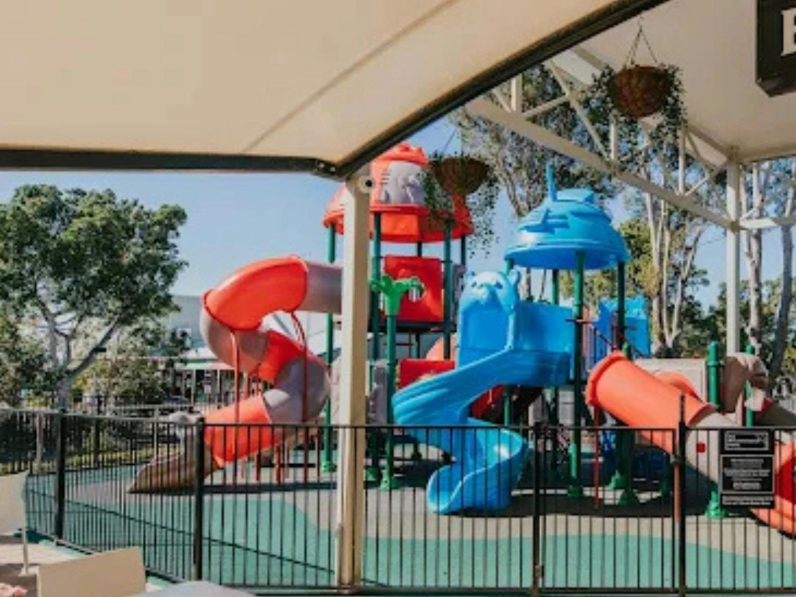 colourful kids playground that is located outside of a venue