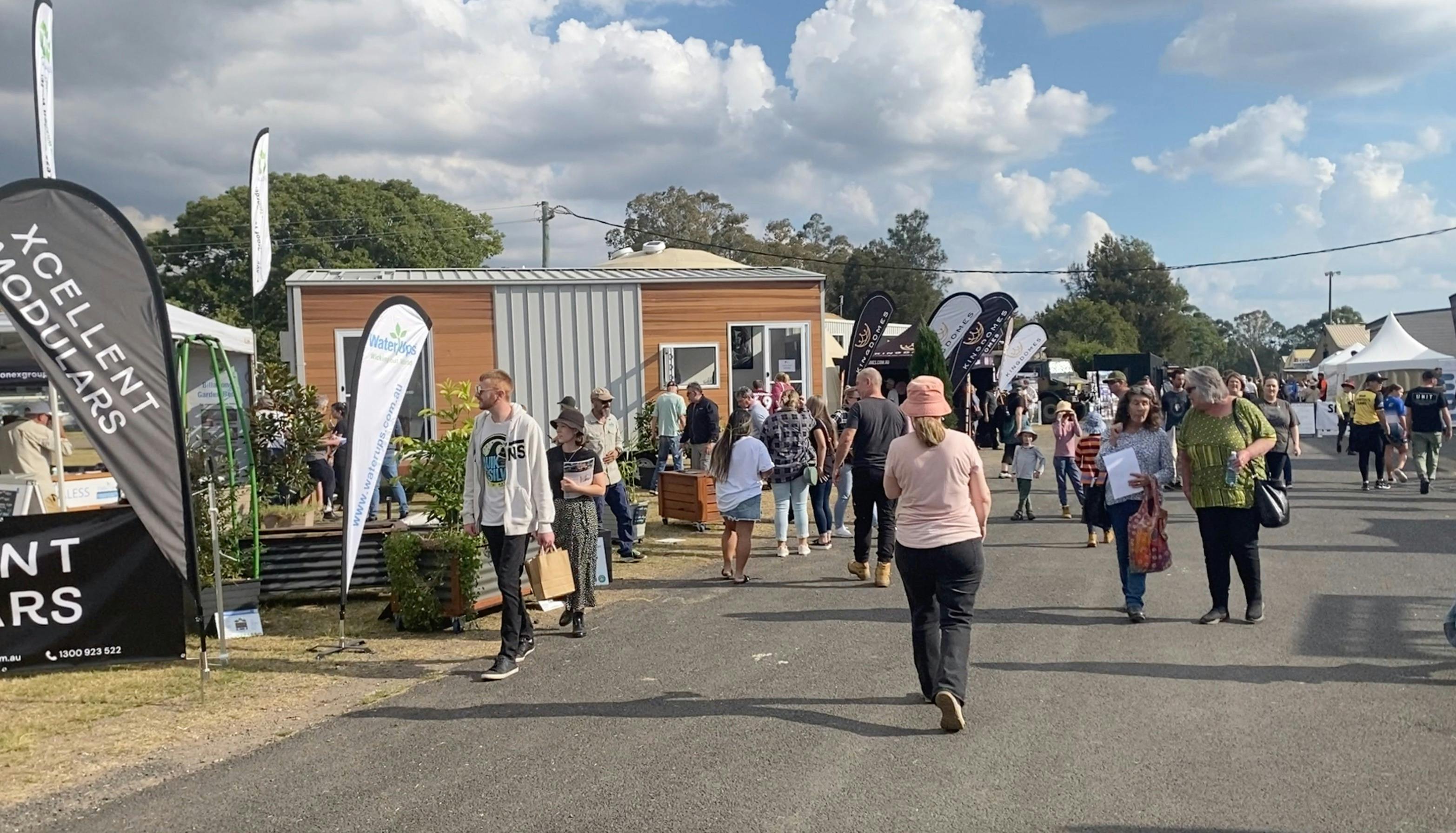 Visitors walking through streets of houses