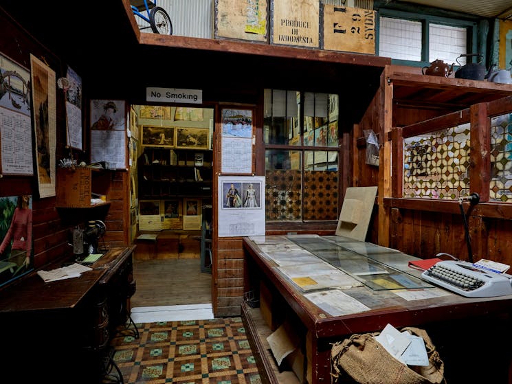 Interior photo of Wing Hing Long with old desk and posters on walls