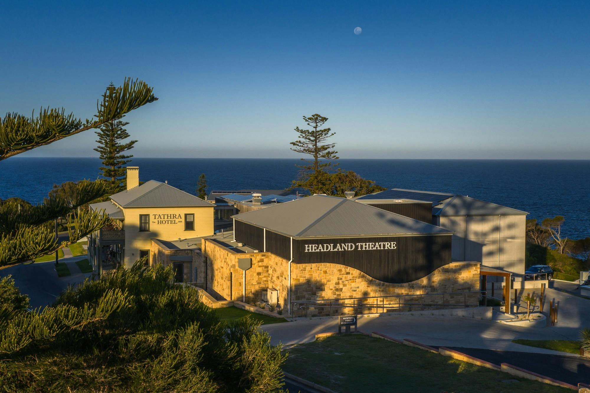 Elevated photograph of exterior of a theatre building that is part of the Tathra Hotel complex