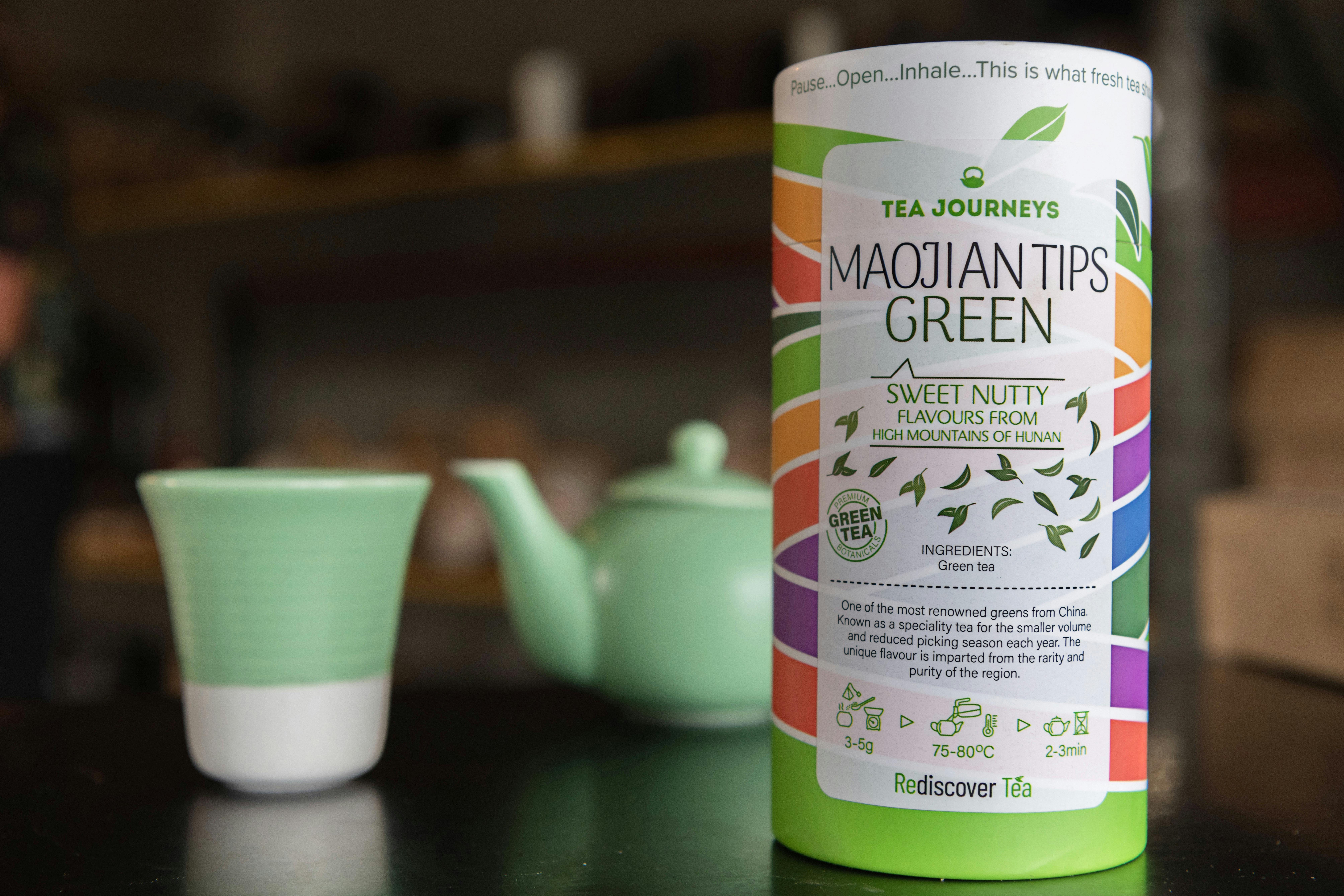 Retail tea packaging and pastel green tea pot