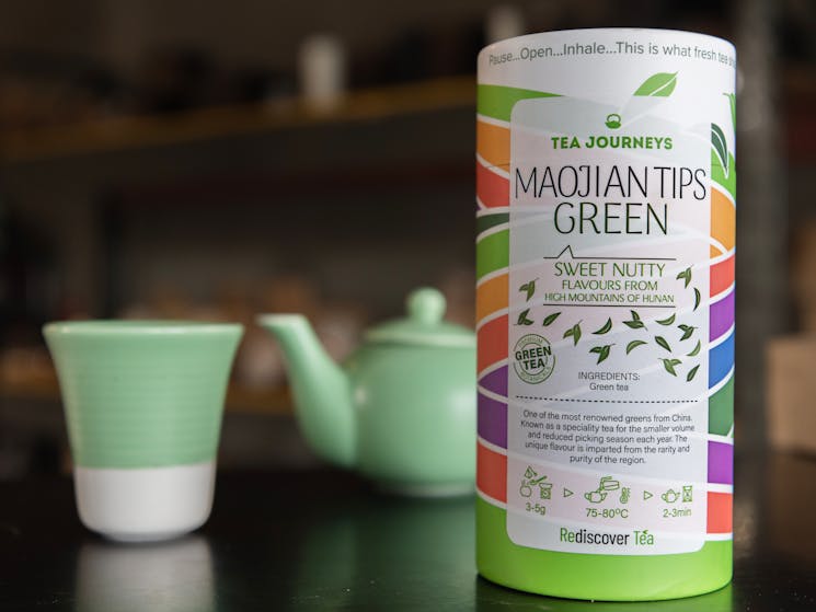 Retail tea packaging and pastel green tea pot
