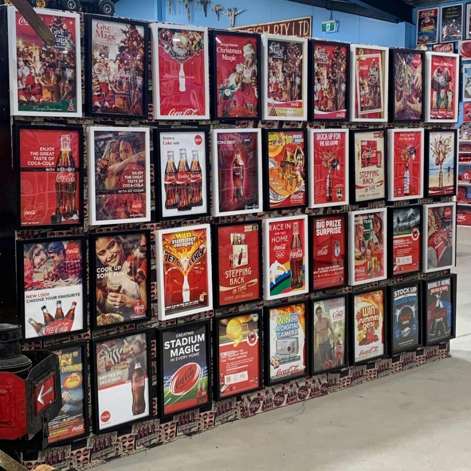 Wall of vintage Coca-cola posters.