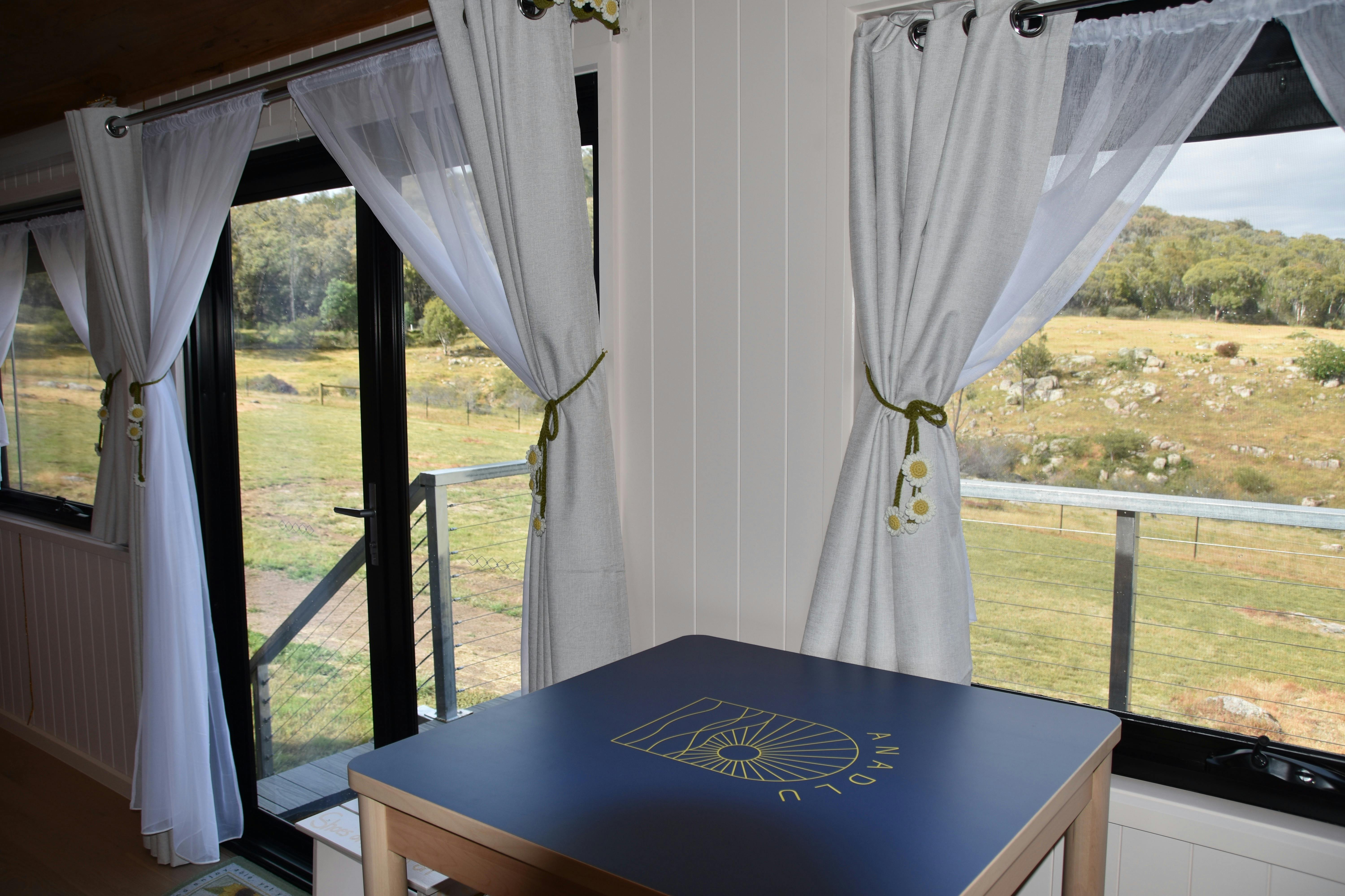 View through Anwen tiny home exterior showing natural light