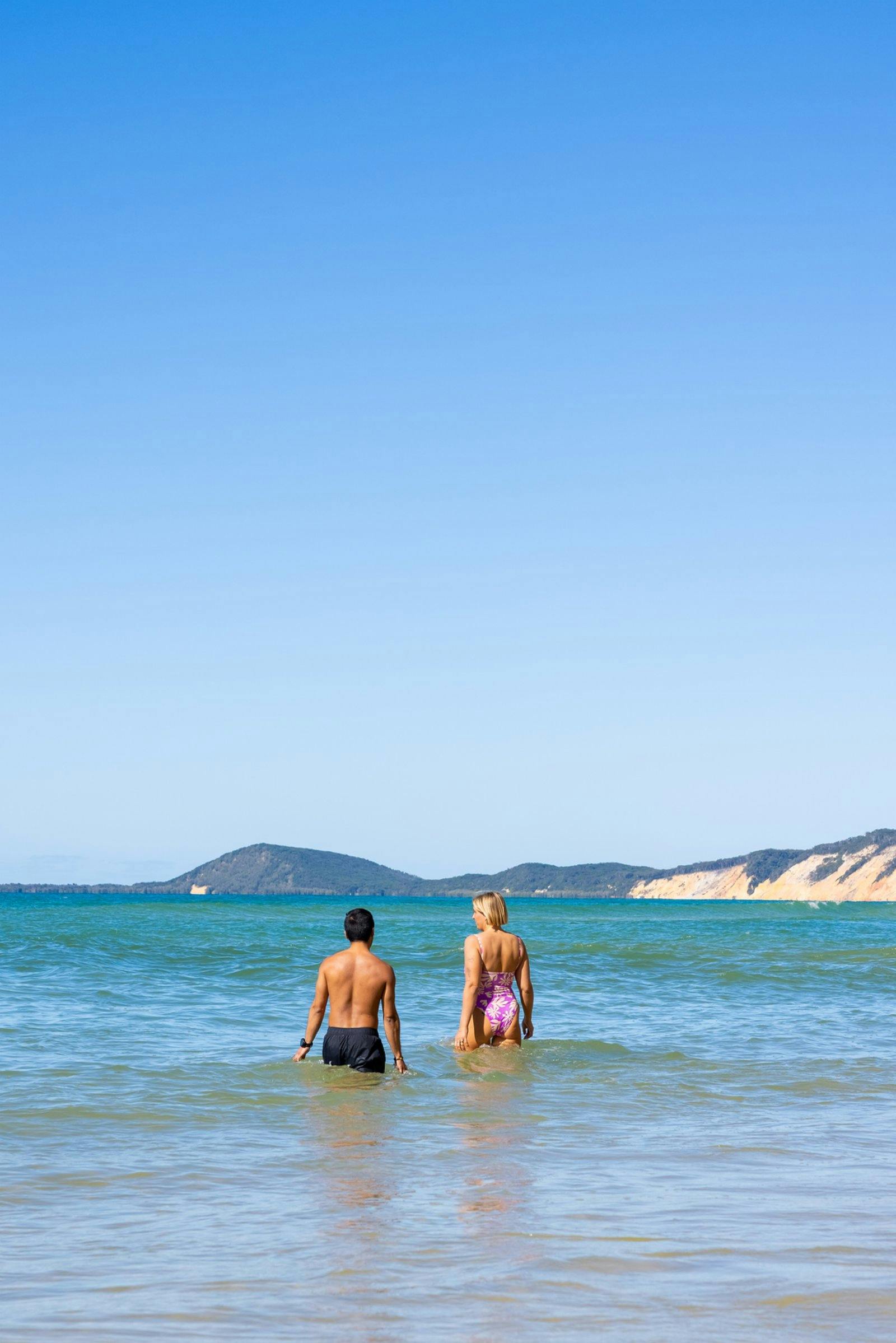 People swimming in the ocean at Carlo Sandblow