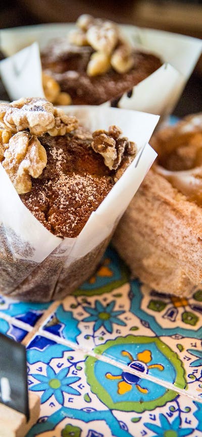 Sweet muffins and pastries on aztec tiles