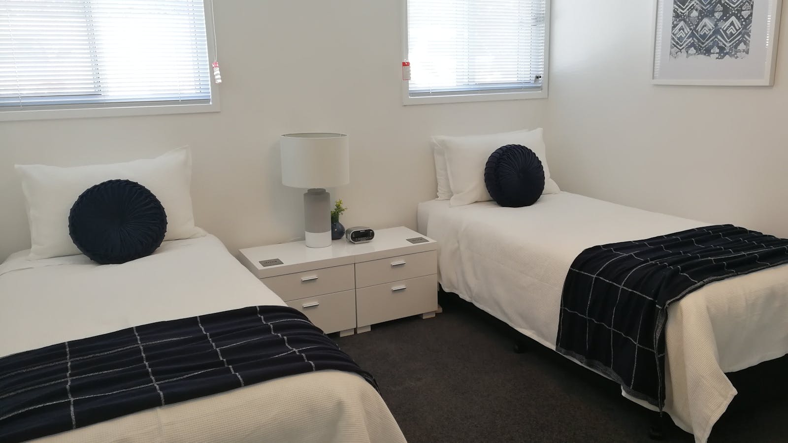 2nd bedroom configuration: king bed or two single beds (shown). Port-a-cot or rollaway can be added.