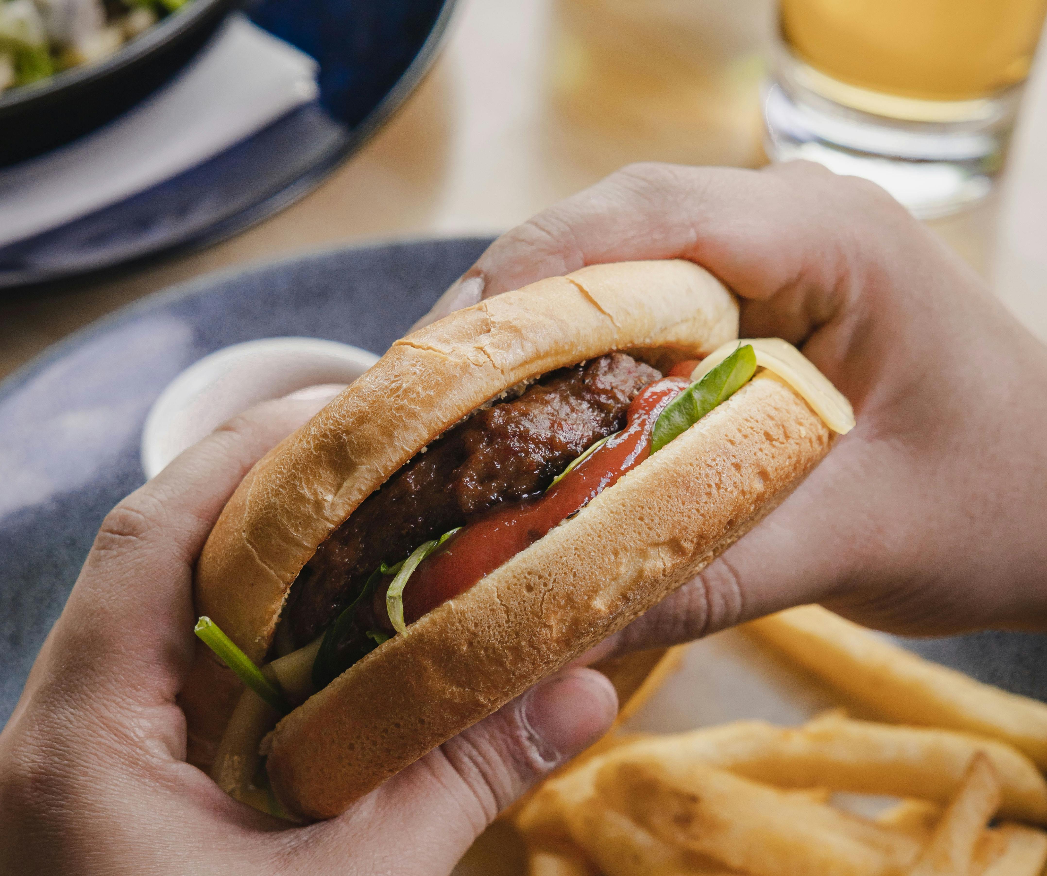 Delicious burger, chips and beer