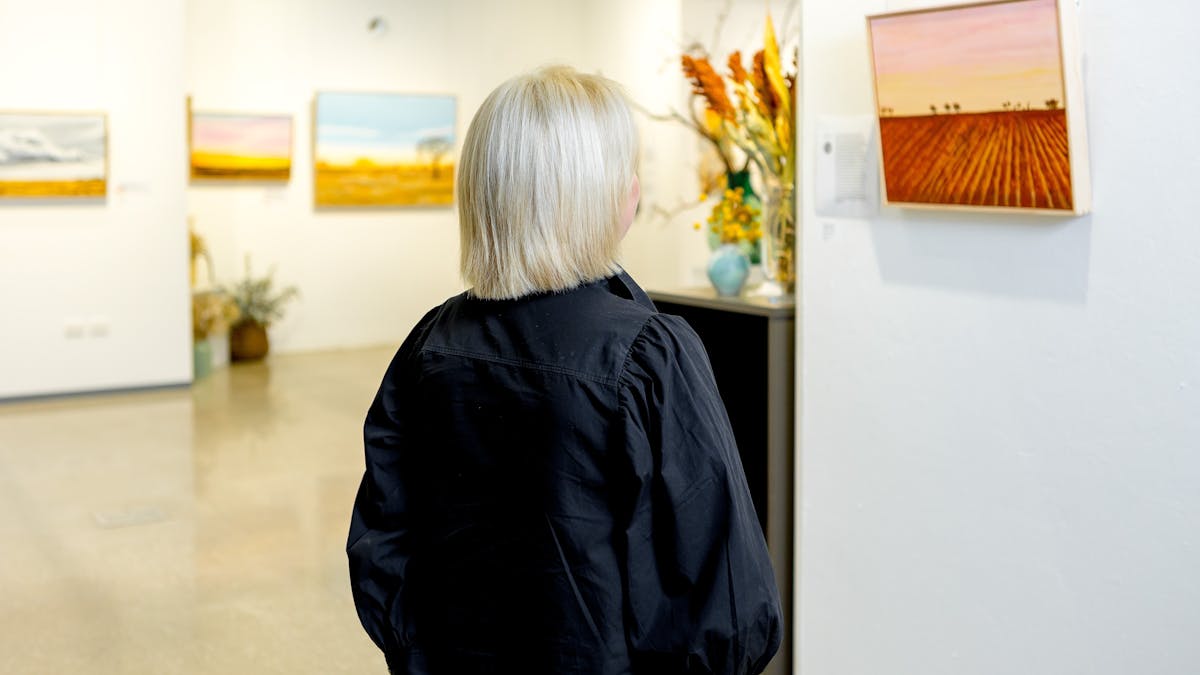 Person admiring artwork Person admiring artwork
