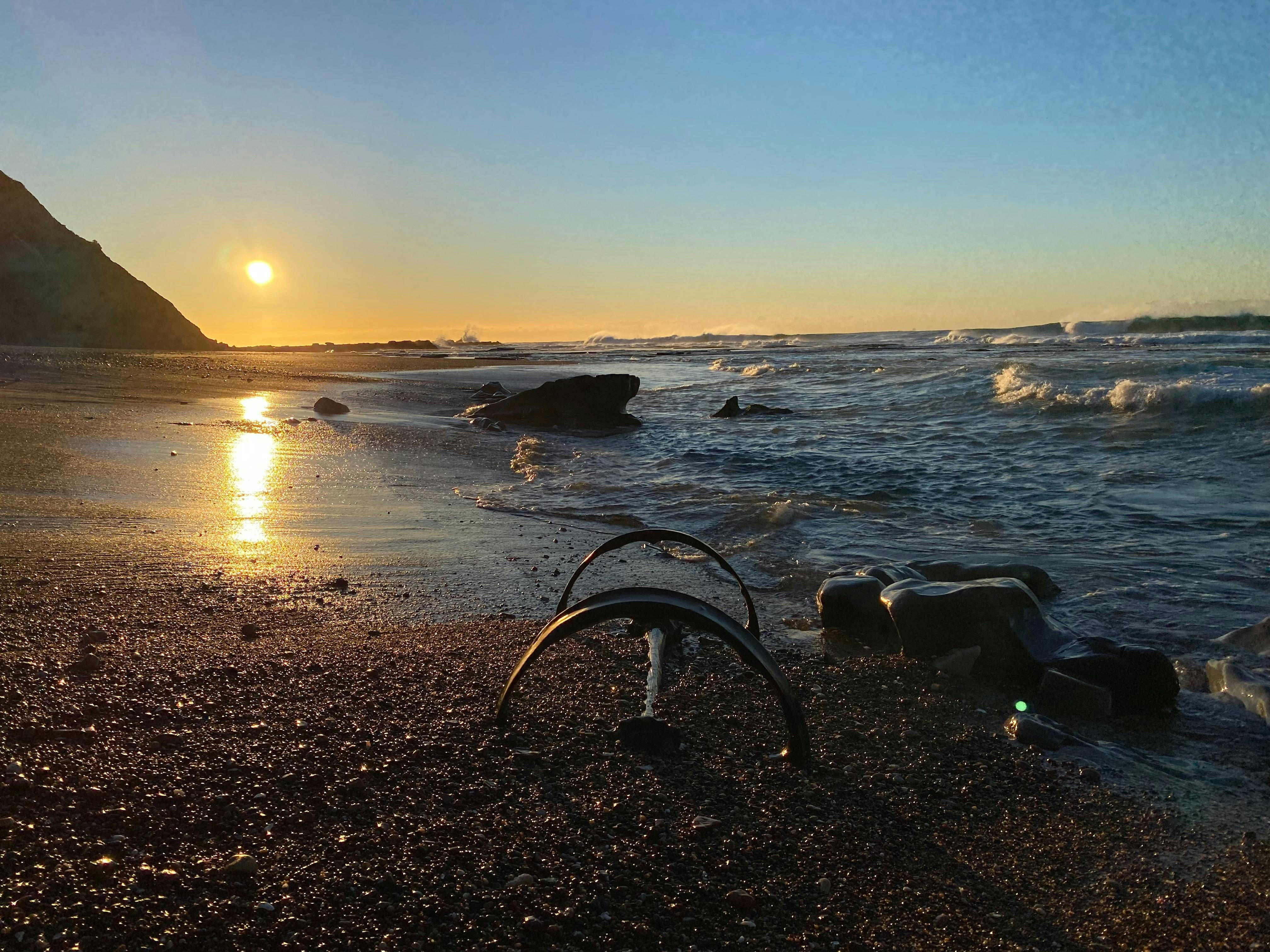 Rusty steel wheels of a coal wagon washed up on Burwood Beach