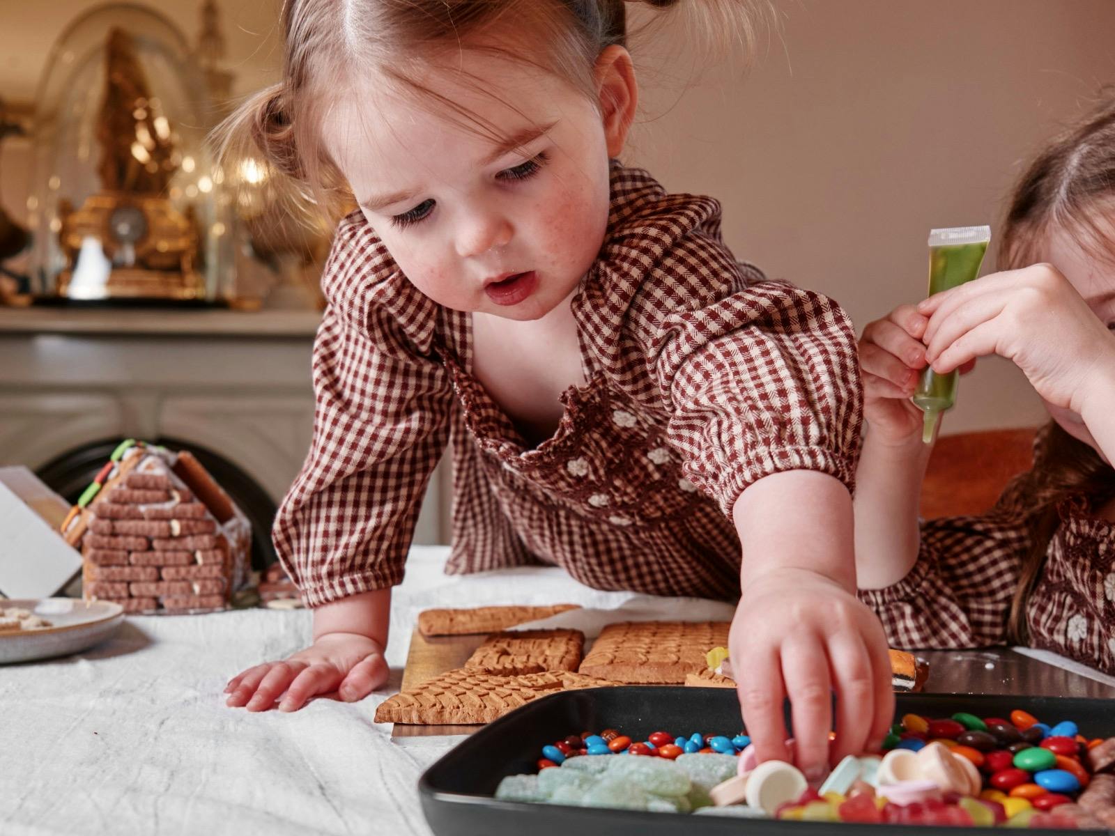 Gingerbread making class at Como House with little girl choosing sweets for house